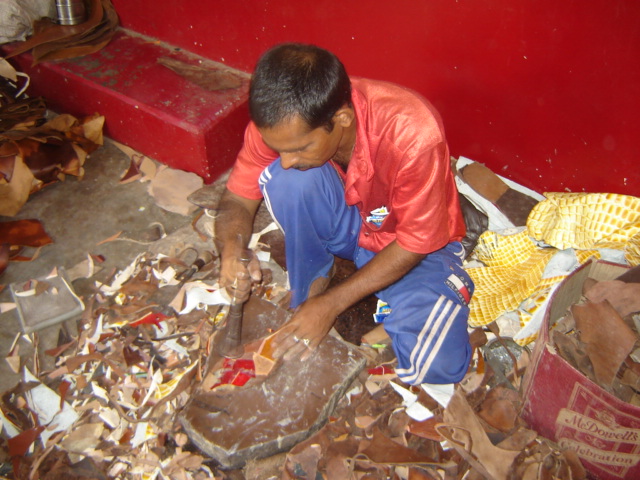 Artisan & Leather Cluster: male artisan leather cutting